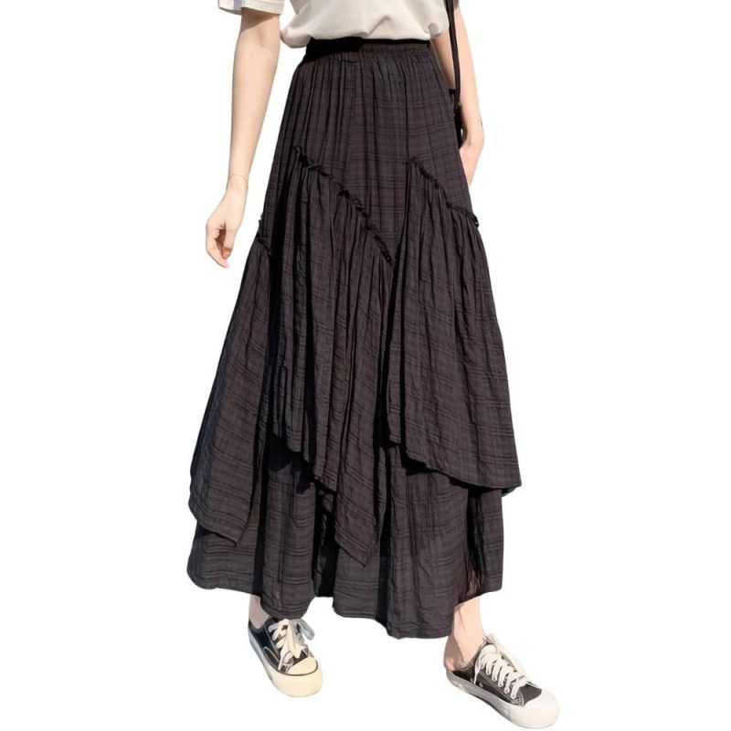 Jupe longue asymétrique noire en tissu écossais à motif tartan, style casual chic