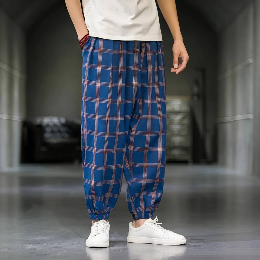 Pantalon écossais homme large bleu et orange avec motif tartan, coupe ample et bas resserré