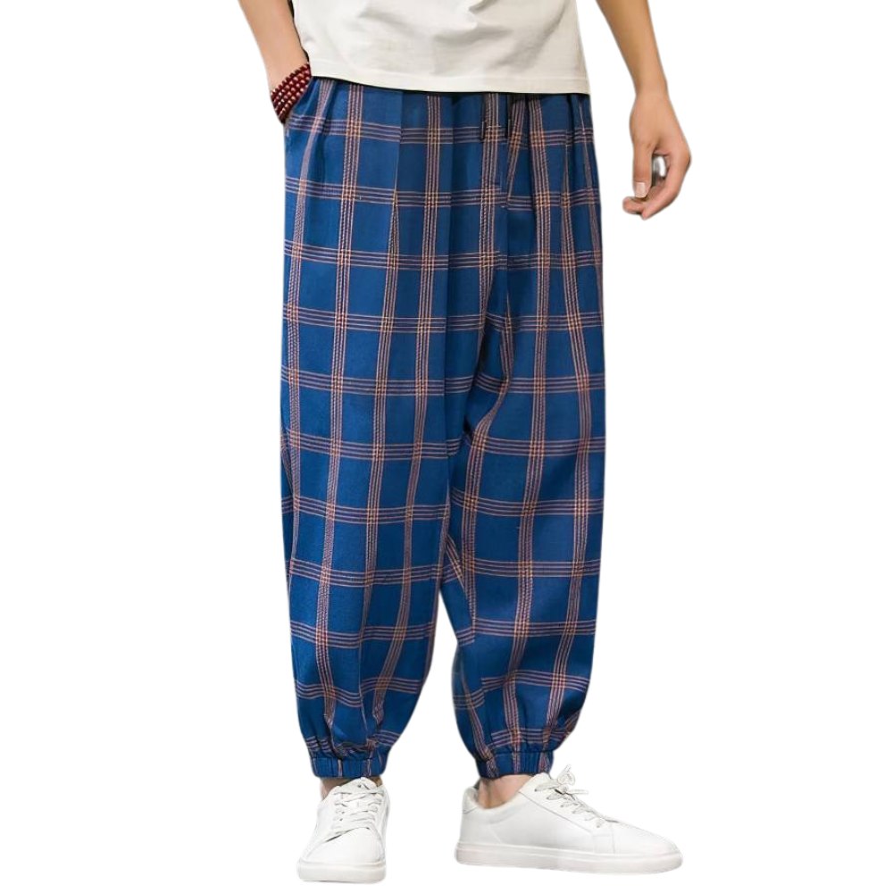 Pantalon homme large en tissu écossais bleu et orange avec motif tartan, coupe ample et bas resserré